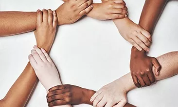 Hands holding each other in a circle