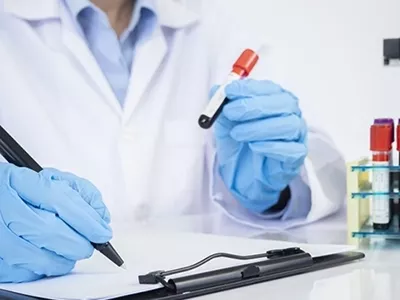 Scientist holding test tube